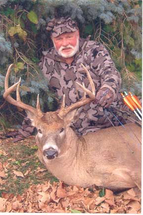 Bob Fratzke from Winona Mn hunting in Mn on Oct 31, 2011.  The deer has an 18" inside spread and 8 points.  Bob always hunts in his Winona Camo hunting clothes