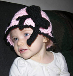 Whimsical crochet hat with a bow in sizes baby thru adult