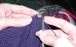 Knit the 2nd stitch loosely, there are now 2 knit stitches on the right knitting needle