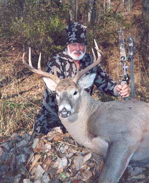 Bob Fratzke with his Whitetail, wearing Winona Camo and Winona Survivor Cap