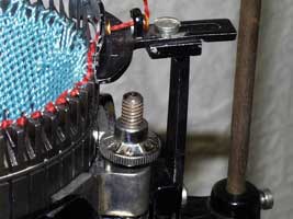 figure 6  shows the yarn carrier for the Ainslie Auto Knitter