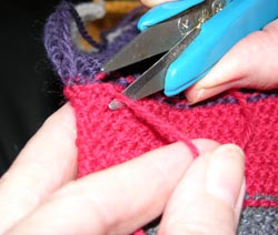 Snip off the Hidden Yarn end close to the knitting, so as not to leave any end yarn protruding