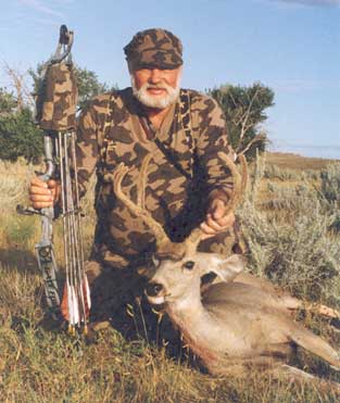 Photo of Bob Fratzke hunting in Wyoming in 1992 wearing his Winona Camo Ridge Runner hat and Winona Camo V neck pullover