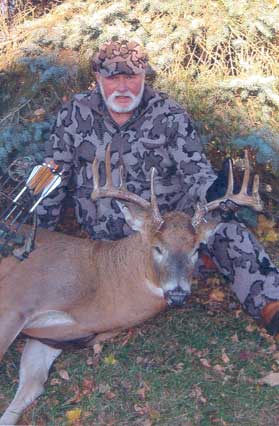 Bob Fratzke still is enthusiastic as every as he hunts in Wi on Nov 6, 2011.  The resulting deer has a 19.5" inside spread with 12 points